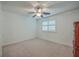 Bright bedroom featuring neutral carpet, white walls, and a ceiling fan for added comfort at 131 Londonderry Rd, Goose Creek, SC 29445