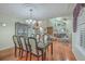 Open floor plan connecting the dining room, living room, and foyer with hardwood floors at 131 Londonderry Rd, Goose Creek, SC 29445