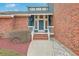 Front porch with brick accents, showcasing the entry to a charming home at 131 Londonderry Rd, Goose Creek, SC 29445