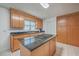 Kitchen with wood cabinets, island with cooktop, and lots of storage space at 131 Londonderry Rd, Goose Creek, SC 29445