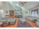Large living room features a fireplace, hardwood floors, and an open and airy layout at 131 Londonderry Rd, Goose Creek, SC 29445