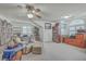 A cozy living room with a ceiling fan, a comfortable sofa, and built-in shelves with an arched window at 131 Londonderry Rd, Goose Creek, SC 29445