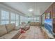 Relaxing sunroom featuring comfortable seating, a brick wall, and lots of natural light at 131 Londonderry Rd, Goose Creek, SC 29445