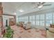 Bright sunroom with tile flooring and abundant natural light from surrounding windows at 131 Londonderry Rd, Goose Creek, SC 29445