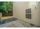 Backyard with wood fence and stone patio and window, ideal for Gathering time and outdoor entertainment at 1320 Garland St, North Charleston, SC 29420