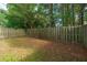 Lawn, surrounded by a wooden fence, giving space and privacy to enjoy the outdoors, in a serene backyard at 1320 Garland St, North Charleston, SC 29420