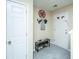 Bright foyer with tiled flooring, shoe storage, and a decorative monogram at 1320 Garland St, North Charleston, SC 29420