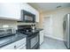 Functional kitchen with modern appliances, white cabinets, and granite countertops at 1320 Garland St, North Charleston, SC 29420