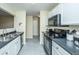 Functional kitchen featuring stainless steel appliances, black countertops and white cabinets at 1320 Garland St, North Charleston, SC 29420