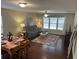 Inviting living room featuring a comfortable gray sofa, area rug, and adjacent dining area with a table set for four at 1320 Garland St, North Charleston, SC 29420