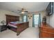 Spacious bedroom with a large bed, a ceiling fan, and ample natural light from the windows at 1320 Garland St, North Charleston, SC 29420