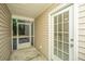 Enclosed patio with screen door and door to the interior, perfect for relaxation and outdoor activities at 1320 Garland St, North Charleston, SC 29420
