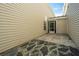 Back patio featuring partial stonework and light siding, offering a private and serene retreat at 1320 Garland St, North Charleston, SC 29420