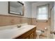 Well-lit bathroom featuring decorative tile and a vanity with storage beneath the sink at 1418 Kentwood Circle Cir, Charleston, SC 29412