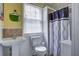 Bathroom featuring pedestal sink, toilet, and shower with curtain at 1418 Kentwood Circle Cir, Charleston, SC 29412