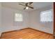 Bright bedroom with hardwood floors, ceiling fan and two windows at 1418 Kentwood Circle Cir, Charleston, SC 29412