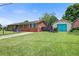 Charming single-story home with a lush front lawn and detached garage at 1418 Kentwood Circle Cir, Charleston, SC 29412