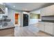 Modern kitchen with white cabinetry, granite countertops, stainless steel appliances and new tile floor at 1418 Kentwood Circle Cir, Charleston, SC 29412