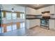 Modern kitchen with white cabinetry, granite countertops, stainless steel appliances and new tile floor at 1418 Kentwood Circle Cir, Charleston, SC 29412