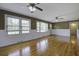 Inviting living room with hardwood floors, wainscoting, and large windows offering natural light at 1418 Kentwood Circle Cir, Charleston, SC 29412