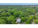 Aerial view of the wooded neighborhood with lush green canopy during the daytime at 1565 Juniper St, Charleston, SC 29407