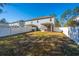 Spacious backyard with white fence and screened porch at 1610 Mermentau St, Mount Pleasant, SC 29466