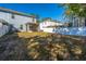Large backyard with a white fence, grill, and screened porch, perfect for outdoor living and entertaining at 1610 Mermentau St, Mount Pleasant, SC 29466