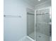 Well-lit bathroom with a glass-enclosed shower and tiled walls at 1610 Mermentau St, Mount Pleasant, SC 29466