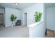 Upstairs hallway with carpeting, neutral paint, chair and plant at 1610 Mermentau St, Mount Pleasant, SC 29466