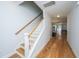 Hallway with wooden floors and a staircase, leading to other areas of the house at 1610 Mermentau St, Mount Pleasant, SC 29466