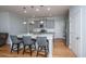 Modern kitchen with island seating, stainless appliances, and hardwood floors at 1610 Mermentau St, Mount Pleasant, SC 29466