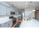 Modern kitchen boasts stainless steel appliances, island, and gray cabinets at 1610 Mermentau St, Mount Pleasant, SC 29466