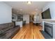 Bright living room featuring a fireplace, modern lighting, and access to kitchen at 1610 Mermentau St, Mount Pleasant, SC 29466