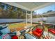 Relaxing screened porch featuring comfortable seating and a built-in grill perfect for outdoor dining at 1610 Mermentau St, Mount Pleasant, SC 29466
