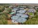 Comprehensive aerial view showcasing the tennis courts, surrounding residential homes at 1613 Live Oak Park, Seabrook Island, SC 29455