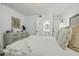 Bright bedroom with a view to a connected bathroom featuring a sleek pedestal sink at 1613 Live Oak Park, Seabrook Island, SC 29455