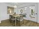 Dining area featuring wood table, stylish seating, and natural lighting with door to outside at 1613 Live Oak Park, Seabrook Island, SC 29455