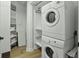 Convenient laundry room with stacked washer and dryer and ample storage space at 1613 Live Oak Park, Seabrook Island, SC 29455