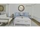 Relaxing living room featuring modern furniture, shiplap walls, and a striking round mirror at 1613 Live Oak Park, Seabrook Island, SC 29455