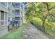 Community backyard showcasing greenery, walking space, and trees at 1623 Telfair Way, Charleston, SC 29412