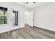 Bedroom features wood floors, door to balcony, and an open closet at 1623 Telfair Way, Charleston, SC 29412
