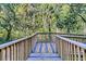 Wooden deck surrounded by lush greenery at 1623 Telfair Way, Charleston, SC 29412