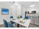 Bright dining room with marble table, modern decor, and access to the kitchen at 1623 Telfair Way, Charleston, SC 29412