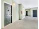 Condo hallway featuring multiple unit entrances with neutral walls and modern lighting fixtures at 1623 Telfair Way, Charleston, SC 29412