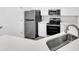 Modern kitchen featuring stainless steel appliances, white cabinetry, and quartz counters at 1623 Telfair Way, Charleston, SC 29412