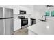 Modern kitchen featuring stainless steel appliances, white cabinetry, and quartz counters at 1623 Telfair Way, Charleston, SC 29412