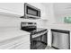 Modern kitchen featuring stainless steel appliances, white cabinetry, and quartz counters at 1623 Telfair Way, Charleston, SC 29412