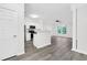 Open-concept floor plan features modern kitchen, hardwood floors, and neutral paint at 1623 Telfair Way, Charleston, SC 29412