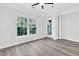 Living room featuring hardwood floors, a ceiling fan, and lots of natural light at 1623 Telfair Way, Charleston, SC 29412