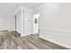 Spacious living room featuring neutral walls and modern gray flooring at 1623 Telfair Way, Charleston, SC 29412